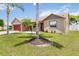 Inviting single-story home boasts a lush green lawn and beautiful landscaping at 2407 Accord Ter, Kissimmee, FL 34758