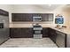 Modern kitchen features stainless steel appliances, ample cabinet space, and a functional layout at 2407 Accord Ter, Kissimmee, FL 34758
