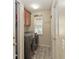 Modern laundry room features front-loading washer and dryer with overhead cabinets and a window at 2407 Accord Ter, Kissimmee, FL 34758