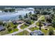 Great aerial view of home and neighborhood near the water and lush landscaping at 2562 Sheffield Dr, Deltona, FL 32738