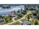 Great aerial view of home and neighborhood near the water and lush landscaping at 2562 Sheffield Dr, Deltona, FL 32738