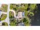 Aerial view of house with fenced-in pool, garden area and backing up to canal and cul-de-sac street at 2562 Sheffield Dr, Deltona, FL 32738