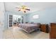 Bedroom with tile floors and French doors leading to additional living space at 2562 Sheffield Dr, Deltona, FL 32738