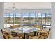 Breakfast nook overlooking a serene lake view from screened lanai at 2562 Sheffield Dr, Deltona, FL 32738