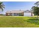 Charming single-story home features a well-manicured lawn and attached two-car garage at 2562 Sheffield Dr, Deltona, FL 32738