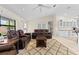 Tile-floored living room features an open design, fireplace, and generous seating for relaxation and entertainment at 2562 Sheffield Dr, Deltona, FL 32738