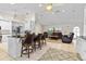 Open-concept living area with a kitchen island and comfortable seating arrangement at 2562 Sheffield Dr, Deltona, FL 32738