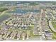 Beautiful aerial view of a home near a community pond in a neighborhood at 2598 Trielle Ave, Kissimmee, FL 34741