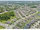 Gorgeous aerial view of the neighborhood featuring well-maintained lawns and beautiful landscaping at 2598 Trielle Ave, Kissimmee, FL 34741