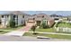 Aerial view of a well-manicured front yard with a home featuring a 2-car garage at 2598 Trielle Ave, Kissimmee, FL 34741
