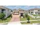 Aerial view showcasing the front of a well-maintained home with a two-car garage at 2598 Trielle Ave, Kissimmee, FL 34741