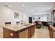 Spacious kitchen with a large island, stainless steel dishwasher, and lots of cabinets at 2598 Trielle Ave, Kissimmee, FL 34741