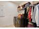 Practical laundry room with modern washer and dryer and ample storage shelves at 2598 Trielle Ave, Kissimmee, FL 34741