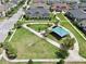 Community park area with playground, mature landscaping, and walking paths at 2598 Trielle Ave, Kissimmee, FL 34741