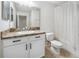 Cozy bathroom with a single sink vanity and shower with curtain at 3018 Bargate St, Orlando, FL 32824