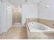 Bright bathroom with tile flooring and a standalone shower at 3018 Bargate St, Orlando, FL 32824