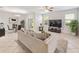 Cozy living room with neutral decor, a comfortable sofa, tile flooring, and access to the outdoor patio at 3018 Bargate St, Orlando, FL 32824