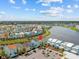 A community's location features lakes, colorful homes, and ample parking at 3020 Parrot Head Pl, Kissimmee, FL 34747