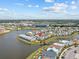 Aerial view showing the location of a resort community near a lake and theme parks at 3020 Parrot Head Pl, Kissimmee, FL 34747