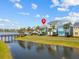 Exterior view highlighting the home's proximity to the water and community amenities at 3020 Parrot Head Pl, Kissimmee, FL 34747