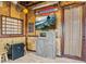 Unique themed living room with bamboo walls, arcade games, and entertainment at 3020 Parrot Head Pl, Kissimmee, FL 34747