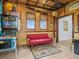 Fun living room with unique bamboo decor, pinball machine, and bright windows at 3020 Parrot Head Pl, Kissimmee, FL 34747