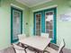 Outdoor patio with seating and convenient access via glass paneled, double doors at 3020 Parrot Head Pl, Kissimmee, FL 34747