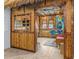 Unique recreation room with tiki bar decor, bamboo accents, thatched roof, and a tropical ambiance at 3020 Parrot Head Pl, Kissimmee, FL 34747