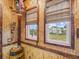 A themed room shows two windows with bamboo blinds, colorful parrot, and ocean-themed accents at 3020 Parrot Head Pl, Kissimmee, FL 34747