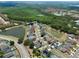 Aerial view of a home in a beautiful, landscaped neighborhood with multiple ponds and wooded areas at 3029 Bransbury Ct, Kissimmee, FL 34747