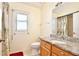 Bathroom featuring granite countertops, tiled floors, and a shower with palm-themed curtains at 3029 Bransbury Ct, Kissimmee, FL 34747