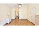 This bedroom has wood-look floors and access to both the bathroom and closet at 3029 Bransbury Ct, Kissimmee, FL 34747