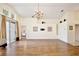 Expansive living room with wood-look flooring, neutral paint, high ceilings and large sliding doors to the outside at 3029 Bransbury Ct, Kissimmee, FL 34747