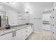 Bright bathroom featuring a double vanity, granite countertops, and modern finishes at 30369 Apricot Ave, Eustis, FL 32736