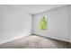 Bright bedroom featuring gray carpet, a window with natural light and neutral walls at 30369 Apricot Ave, Eustis, FL 32736