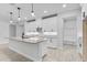 Bright kitchen featuring white cabinets, granite countertops, and an elegant mud room at 30369 Apricot Ave, Eustis, FL 32736