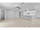 Spacious open-concept floor plan with modern lighting, tile flooring, and a kitchen island at 30369 Apricot Ave, Eustis, FL 32736