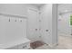 Mudroom with white trim, built-in bench, coat hooks, and storage, enhancing organization and style at 30369 Apricot Ave, Eustis, FL 32736
