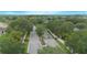 Gated community entrance with lush landscaping and mature trees in a desirable neighborhood at 3128 Stonehurst Cir, Kissimmee, FL 34741