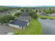 Beautiful aerial shot of lakeside neighborhood homes, featuring mature trees and well-maintained green spaces and landscaping at 3128 Stonehurst Cir, Kissimmee, FL 34741
