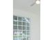 Bright bedroom featuring a large window with backyard views and a modern ceiling fan at 3128 Stonehurst Cir, Kissimmee, FL 34741