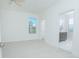 Airy bedroom with neutral walls, light flooring, ensuite bathroom, and walk-in closet at 3128 Stonehurst Cir, Kissimmee, FL 34741