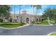 Beautiful clubhouse featuring stone accents, manicured landscaping, and a welcoming entrance at 3128 Stonehurst Cir, Kissimmee, FL 34741