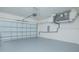 Spacious two car garage with newly painted floor, ample room for parking and storage at 3128 Stonehurst Cir, Kissimmee, FL 34741