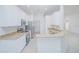 Modern kitchen with white cabinets, stainless appliances, granite countertops and an open layout at 3128 Stonehurst Cir, Kissimmee, FL 34741