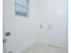 Clean laundry room with access door and space for washer and dryer at 3128 Stonehurst Cir, Kissimmee, FL 34741
