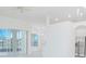 Bright living room features sliding glass doors, neutral paint, modern lighting and light wood-look flooring at 3128 Stonehurst Cir, Kissimmee, FL 34741