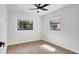 This bedroom has a ceiling fan and two windows which give a lot of natural light to the room at 3397 Janet St, Apopka, FL 32712