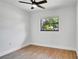 Bright bedroom with wood flooring and a modern ceiling fan offering a comfortable and serene space at 3397 Janet St, Apopka, FL 32712