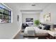 Bright bedroom featuring neutral decor, large windows, and ample natural light, creating a calm and inviting atmosphere at 3397 Janet St, Apopka, FL 32712
